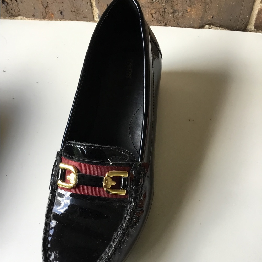 Patent Black Women’s Loafer with Red Strap and Gold Buckle